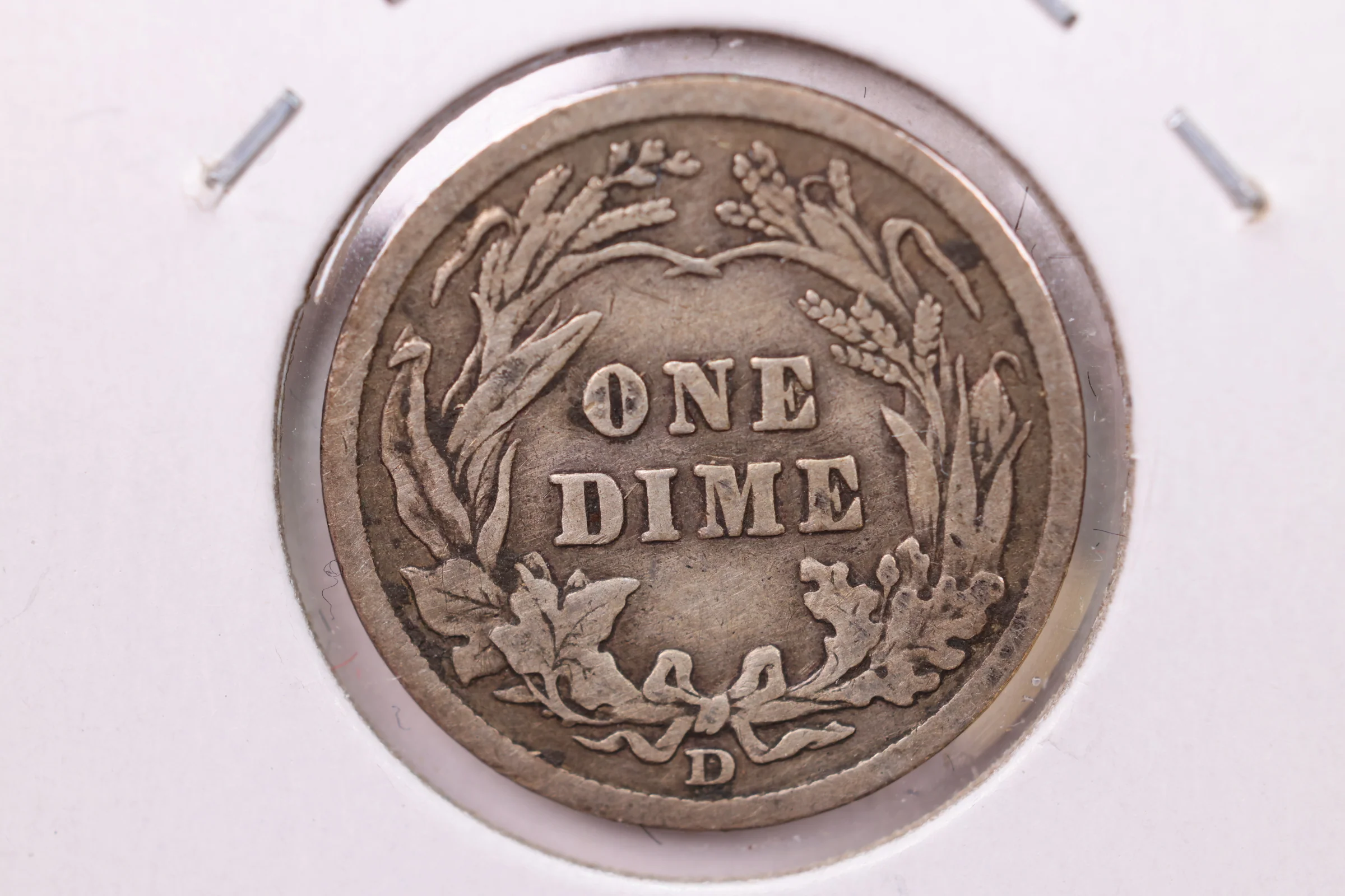 Close-up of 1909-D Barber dime reverse showing the D mintmark below the wreath