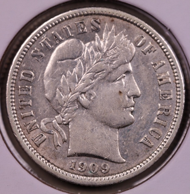 1909 Barber dime doubled die showing doubling on LIBERTY headband alongside off-center strike example